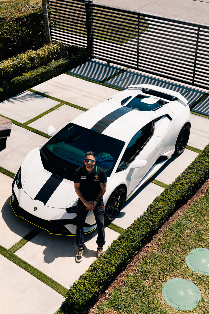 Alessandro beside a Lamborghini